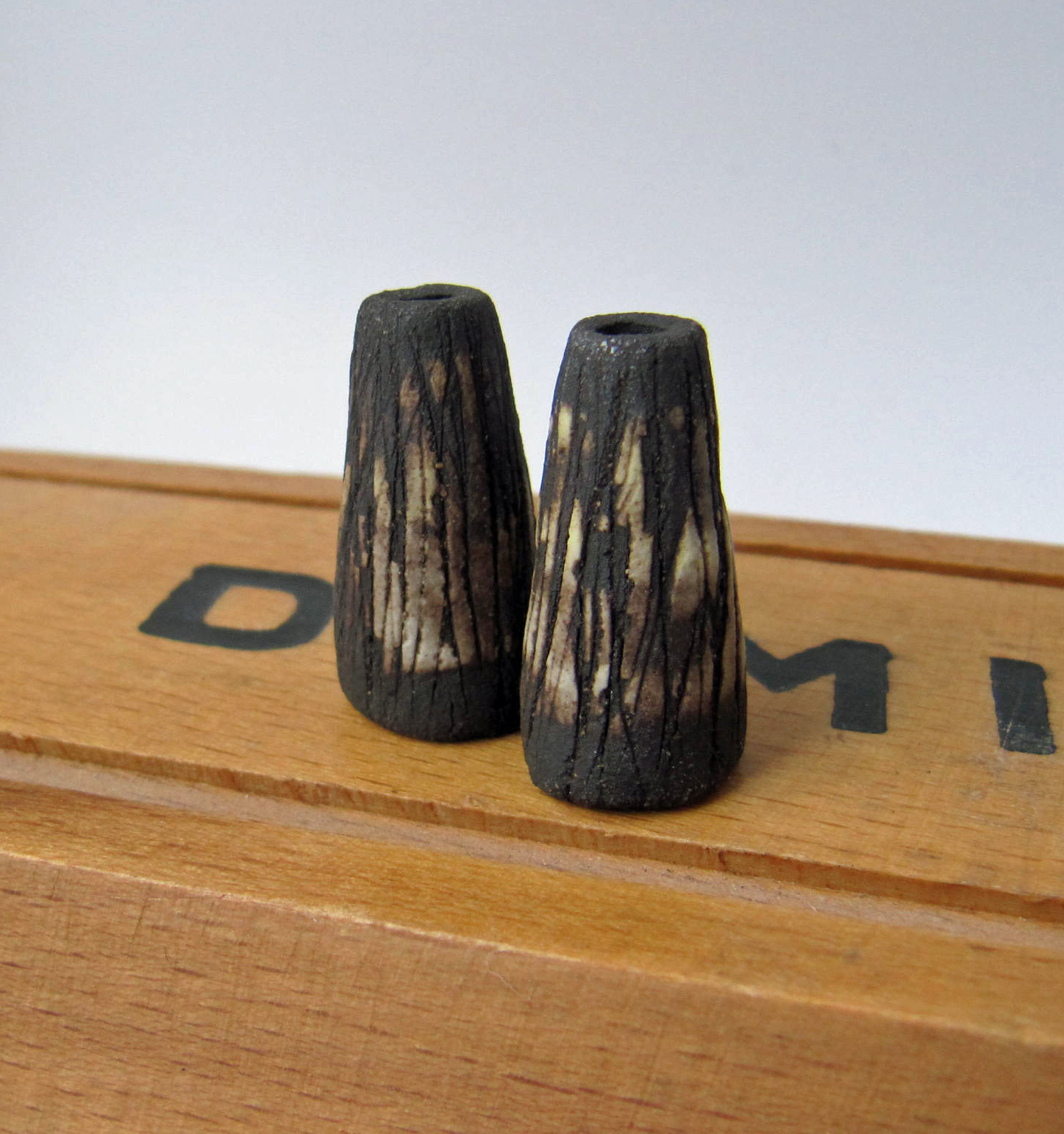 black scored cone pair