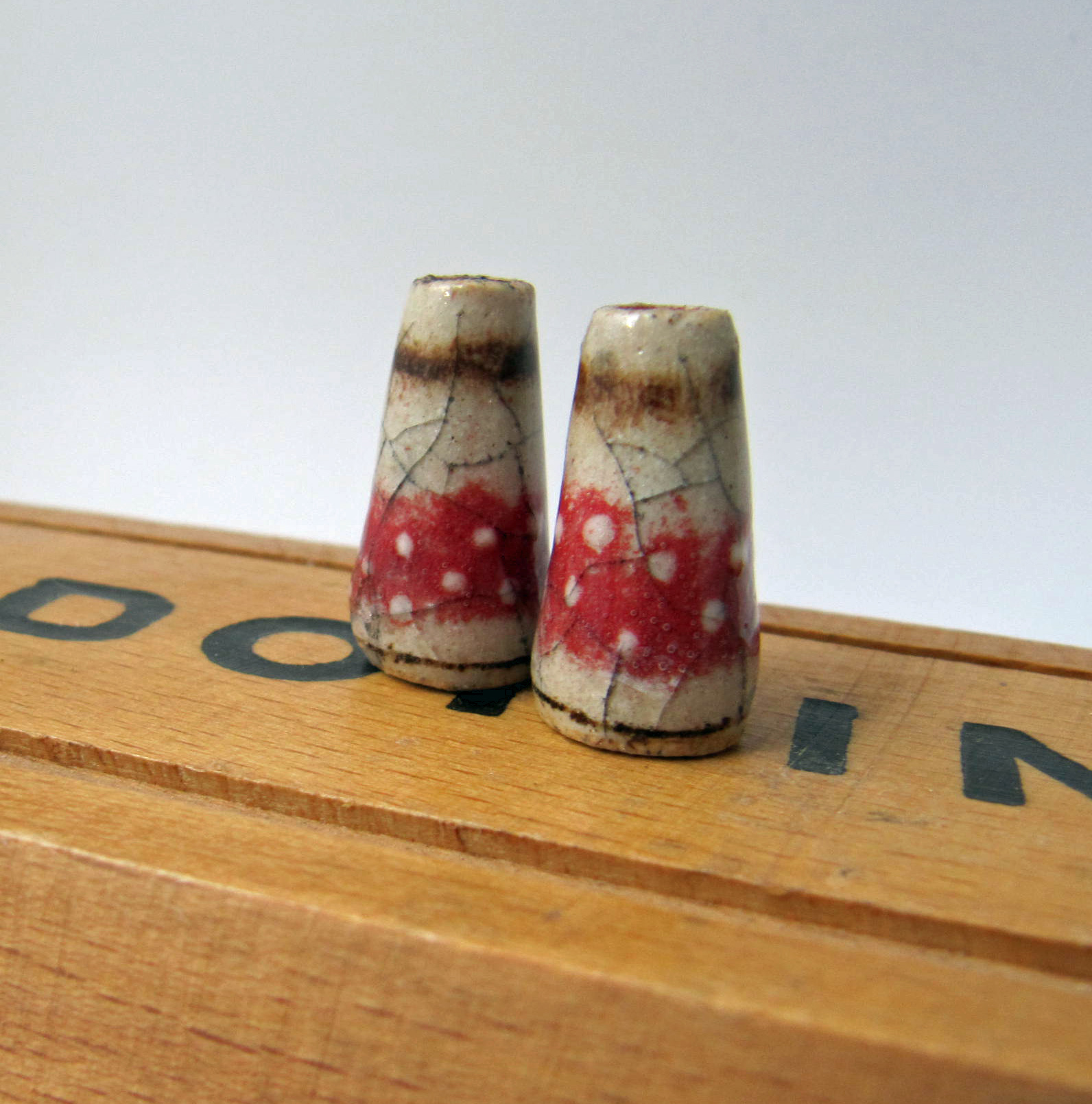 crackle and red dotty cone pair