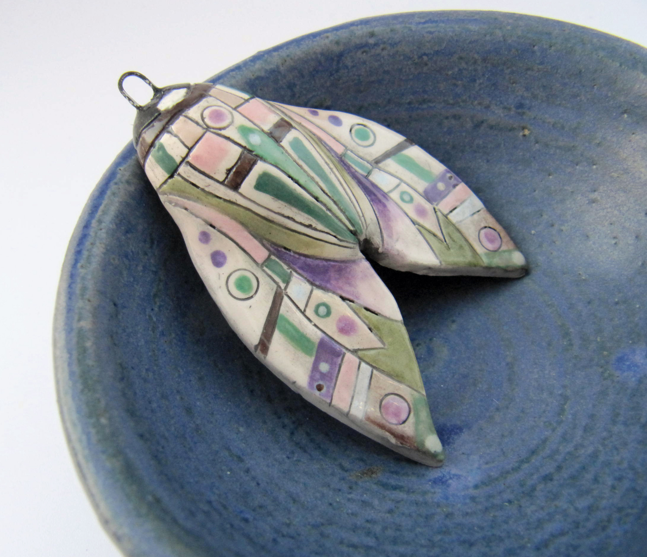 green and purple moth 1