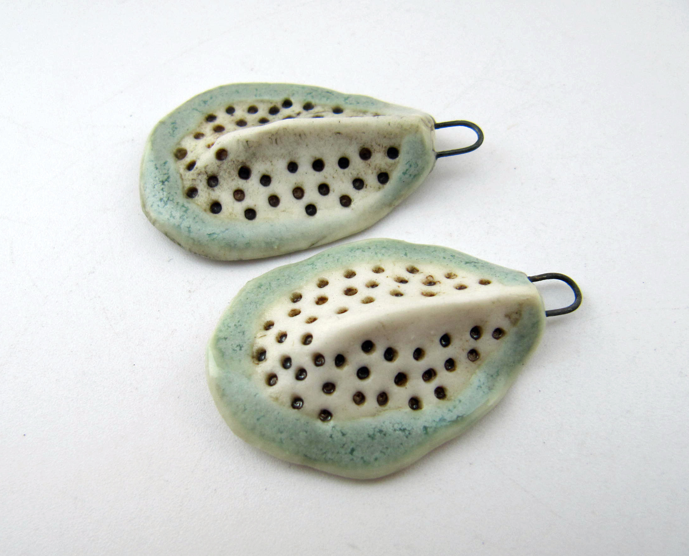 stylised seed charms