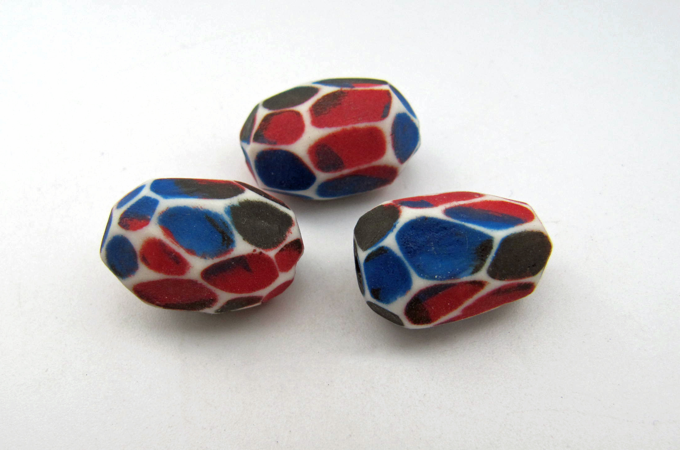 scuffed faceted porcelain nuggets (blue, red, navy)